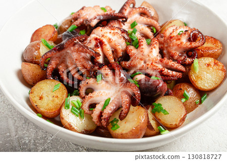 baby grilled octopus with golden baked potatoes and fresh herbs, Maltese cuisine, homemade, no people, 130818727