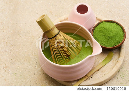 Matcha Tea Preparation. Ceramic bowl with bamboo whisk and matcha powder 130819016