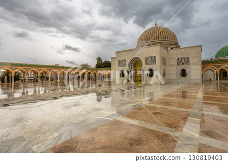 Mausoleum of Habib Bourguiba on a cloudy day with decorated marble courtyard, Monastir 130819403