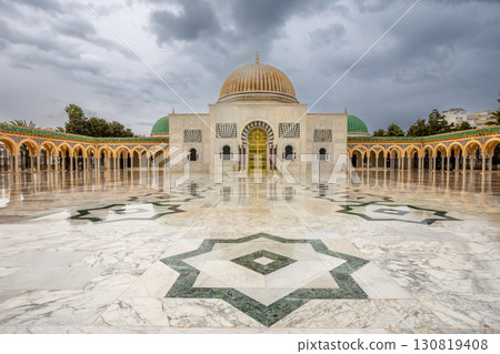 Mausoleum of Habib Bourguiba on a cloudy day with decorated marble courtyard, Monastir 130819408