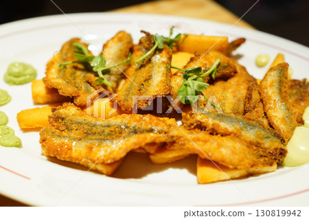 Fried anchovies and panissa (Ligurian chickpea fritters) 130819942
