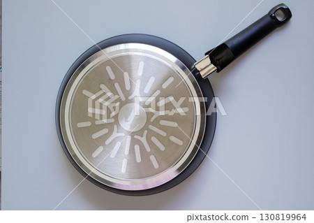 Back of a frying pan on a white background Back of a frying pan on a white background 130819964