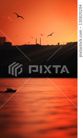 Sunset Over Istanbul with Seagulls, Mosque Silhouette, and Sea View 130820284