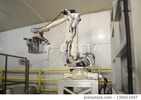Robotic Arms at Modern Factory. Robotic Arms at Modern Factory. 130821097