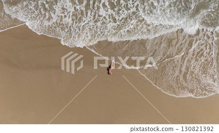 Pregnant Woman Relaxing by the Ocean Aerial Beach Photography Pregnant Woman Relaxing by the Ocean Aerial Beach Photography 130821392