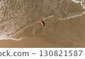 Pregnant Woman Relaxing by the Ocean Aerial Beach Photography 130821587