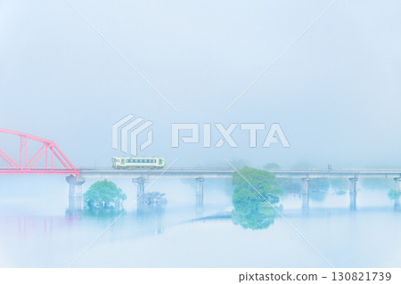 Kitakami Line: Kiha 100 train passing through the submerged forest of Lake Kinshu in the morning mist Kitakami Line: Kiha 100 train passing through the submerged forest of Lake Kinshu in the morning mist 130821739