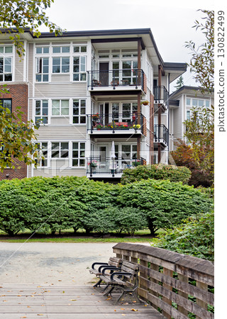 Pathway around the corner of residential building in Fort Langley, BC 130822499