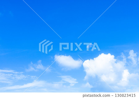 A simple landscape of white clouds and blue sky 130823415