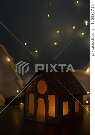Cardboard Lantern handmade house Storytelling creating craft Christmas holiday decoration. Tactile hand-on activity. Master class progress of creative me-made gifts. Seasonal domestic life micro Cardboard Lantern handmade house Storytelling creating craft Christmas holiday decoration. Tactile hand-on activity. Master class progress of creative me-made gifts. Seasonal domestic life micro 130823719