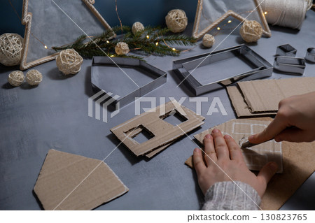 Cardboard paper Lantern House Sustainable Christmas preparation Diy process of making handmade. Step by step activity for children. Inclusive and responsible stress relief holiday hobby Cardboard paper Lantern House Sustainable Christmas preparation Diy process of making handmade. Step by step activity for children. Inclusive and responsible stress relief holiday hobby 130823765