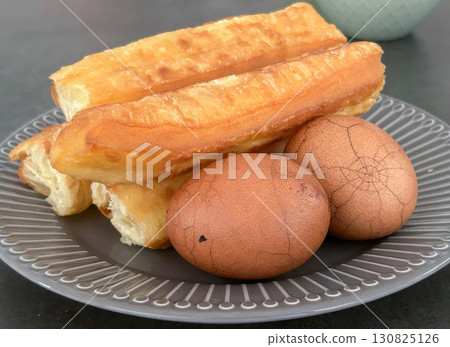 Breakfast of Chinese fried bread and tea eggs 130825126