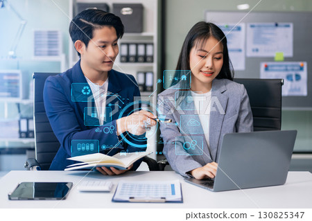 Business team working virtual modern smartphone to reduce CO2 emissions carbon footprint climate change to limit global warming.Sustainable development and green business concept. 130825347