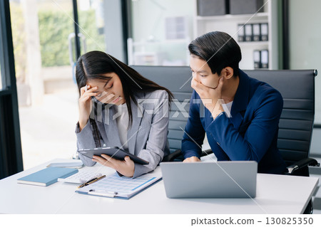 Furious two Asian businesspeople arguing strongly after making a mistake at work in office Furious two Asian businesspeople arguing strongly after making a mistake at work in office 130825350