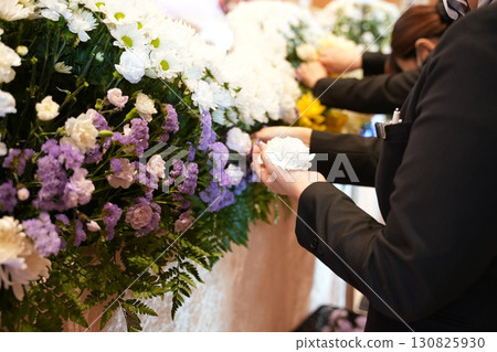 Ceremony lady preparing to say goodbye 130825930