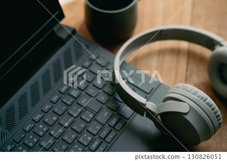 Workspace with laptop and headphones 130826051