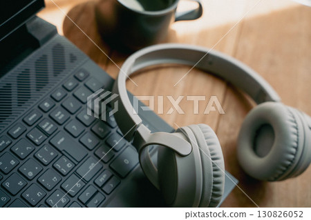 Workspace with laptop and headphones Workspace with laptop and headphones 130826052