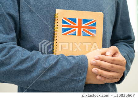 Learn English language, Asian teenage student hold book with flag in course at school. Learn English language, Asian teenage student hold book with flag in course at school. 130826607