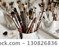 Makeup artist tools glass with brushes. Close-up 130826836