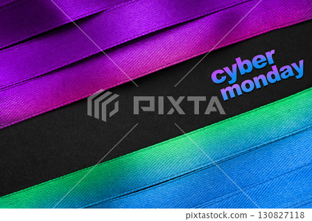 Cyber Monday banner with colorful satin ribbons and modern black background, great for ecommerce, online deals, and tech promotions 130827118