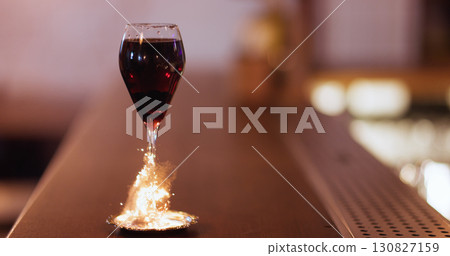 Nightlife cocktail. Drink sparkler. Red wine serving on metal saucer. Glass stem wrapping with golden party fire fiber on pub counter. Nightlife cocktail. Drink sparkler. Red wine serving on metal saucer. Glass stem wrapping with golden party fire fiber on pub counter. 130827159