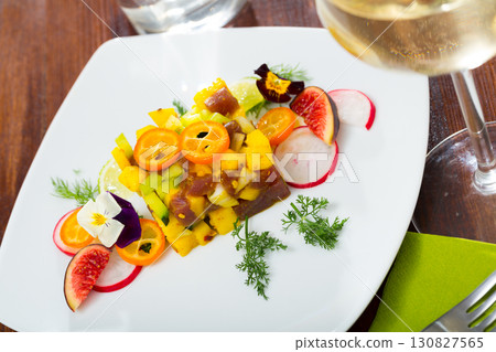 Raw tuna tartare with mango and avocado Raw tuna tartare with mango and avocado 130827565