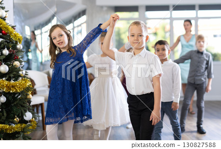 Children rehearsing ballroom dance for upcoming Christmas party at school Children rehearsing ballroom dance for upcoming Christmas party at school 130827588
