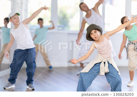 Tween girl mastering krump dance in children dance studio Tween girl mastering krump dance in children dance studio 130828203
