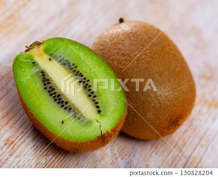 Whole and halved kiwifruits 130828204