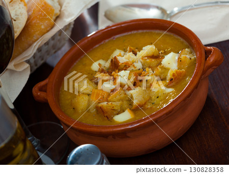 Vegetable soup with croutons and cheese Vegetable soup with croutons and cheese 130828358