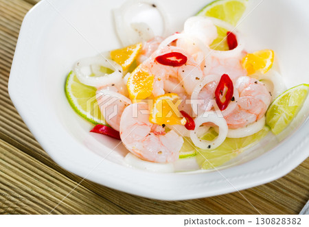Shrimp ceviche with lime, mandarine and chili pepper 130828382
