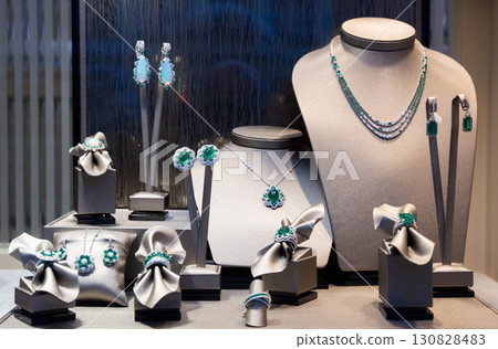 Pendants and bracelets with dimonds in jewelry store 130828483