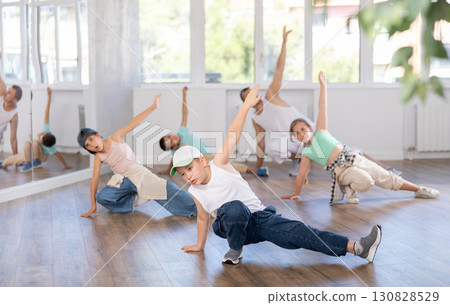 Preteen boy honing hip hop dance moves in choreographic studio Preteen boy honing hip hop dance moves in choreographic studio 130828529