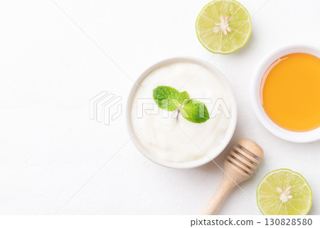 Top view of Yogurt, lime and honey on white background 130828580