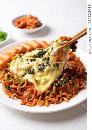 Korean spicy instant noodles with kimchi, sausage and Mozzarella cheese 130828618