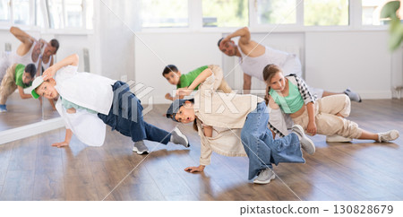 Group of children dancers having break dance training at dance studio Group of children dancers having break dance training at dance studio 130828679