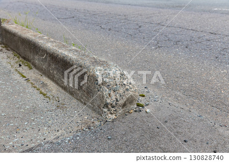 Damaged sidewalk/road boundary block 130828740