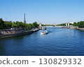 The clear blue Seine River and the Eiffel Tower reflecting the clear blue sky 130829332