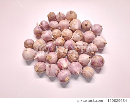Fresh Single Clove Garlic Bulbs on Clean White Background for Cooking and Health Fresh Single Clove Garlic Bulbs on Clean White Background for Cooking and Health 130829684