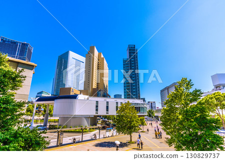 Yokohama cityscape, Japan, September 8th. View of Sakuragicho Station and Akaikutsu from the Air Cabin, with Yokohama City Hall and other buildings in the background. Yokohama cityscape, Japan, September 8th. View of Sakuragicho Station and Akaikutsu from the Air Cabin, with Yokohama City Hall and other buildings in the background. 130829737
