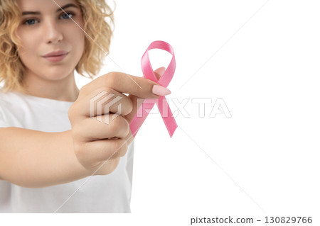 Young woman shows pink ribbon for hope, isolated on white, PNG Young woman shows pink ribbon for hope, isolated on white, PNG 130829766
