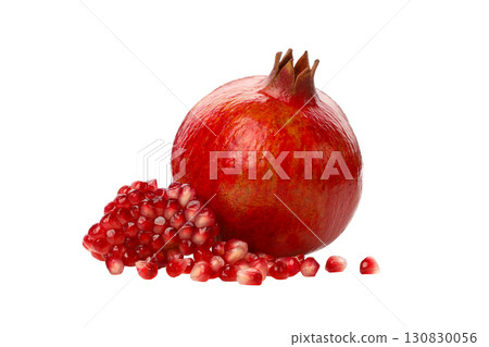 Ripe pomegranate rests next to scattered juicy seeds, isolated, PNG 130830056