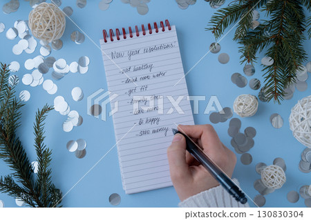 Woman writing promises and aims. Preparation for new year new life new me. Visualizing wish list for 2025. Dreams plan action resolutions for coming year. Inspirational self improvement Woman writing promises and aims. Preparation for new year new life new me. Visualizing wish list for 2025. Dreams plan action resolutions for coming year. Inspirational self improvement 130830304