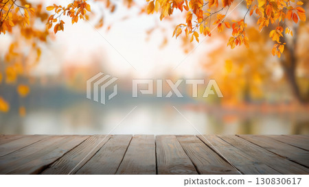 Golden leaves shine by calm water, created with AI 130830617