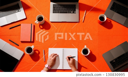 Overhead view of conference table with laptops and coffee. Work from home, remote business, business communication, technology 130830995