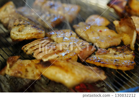 Korean Samgyeopsal (Pork Belly) Grilling on Hot Plate Korean Samgyeopsal (Pork Belly) Grilling on Hot Plate 130832212