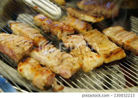 Korean Samgyeopsal (Pork Belly) Grilling on Hot Plate 130832213