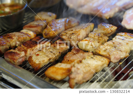 Korean Samgyeopsal (Pork Belly) Grilling on Hot Plate Korean Samgyeopsal (Pork Belly) Grilling on Hot Plate 130832214