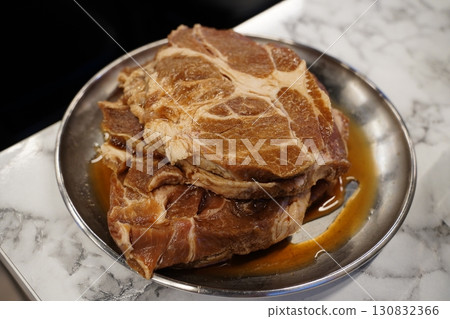 Fresh Marinated Pork on Plate, Ready for Cooking Fresh Marinated Pork on Plate, Ready for Cooking 130832366