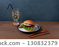 Teriyaki burger on a plate on a wooden table 130832379